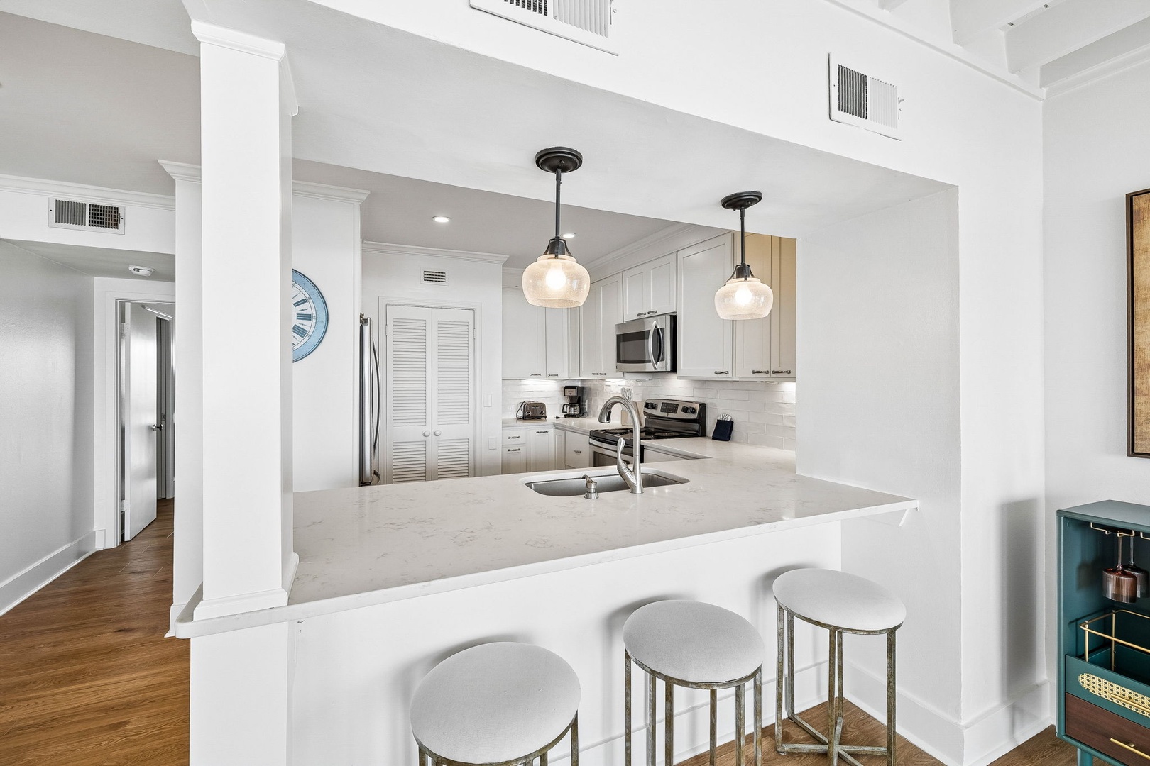 Your bright, open kitchen features modern appliances, gleaming countertops, and a breakfast bar where you can enjoy morning coffee or casual meals together.