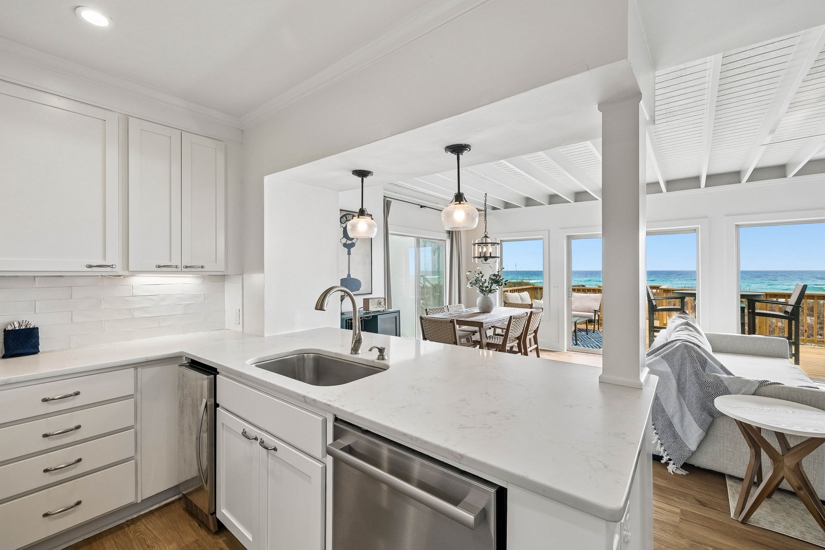 Your coastal retreat features a bright, open kitchen flowing seamlessly into the dining and living areas, where stunning ocean views frame every moment of your stay.