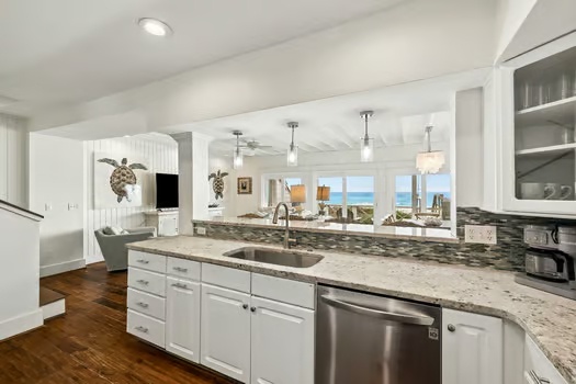 Prepare meals with ocean views in this bright, spacious kitchen. Gleaming countertops, modern appliances, and elegant touches make cooking feel like a luxury.