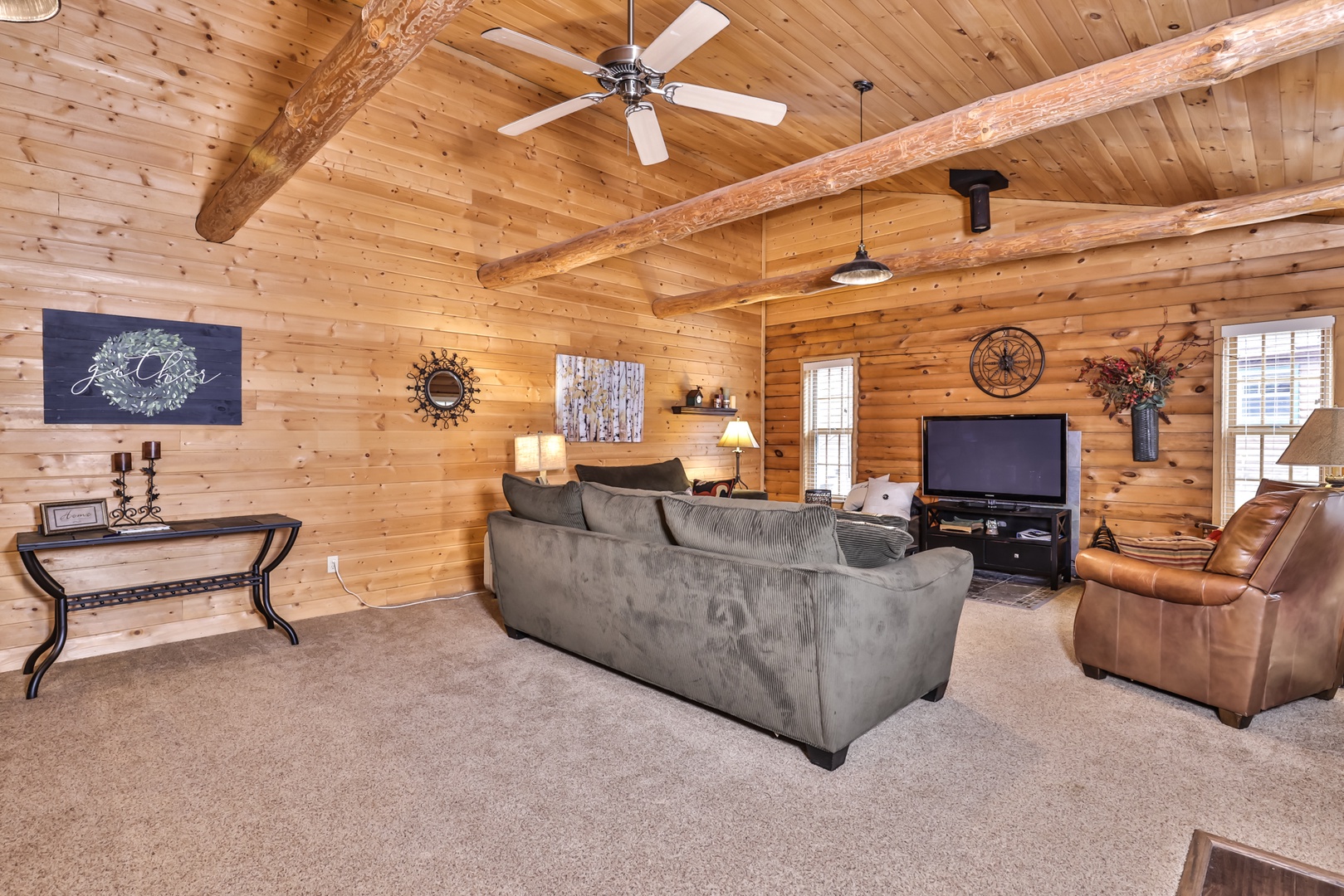 a small and rustic living room or den area of a rustic hunting and fishing  cabin Stock Photo