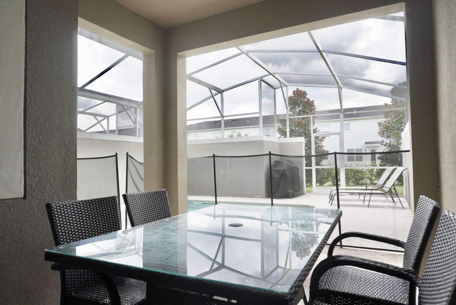 Outside dining table by pool