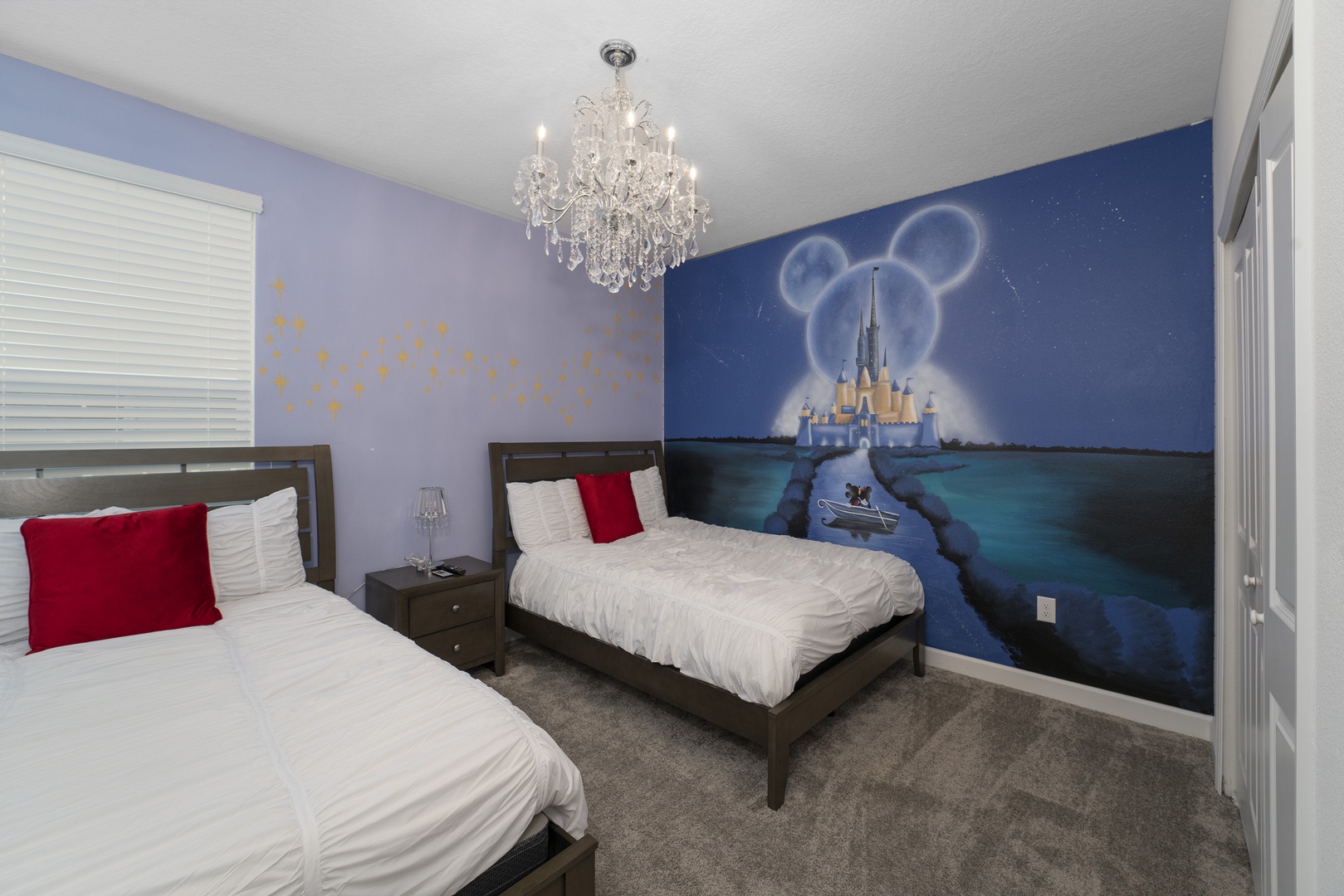 mickey mouse decor room with 2 twin beds