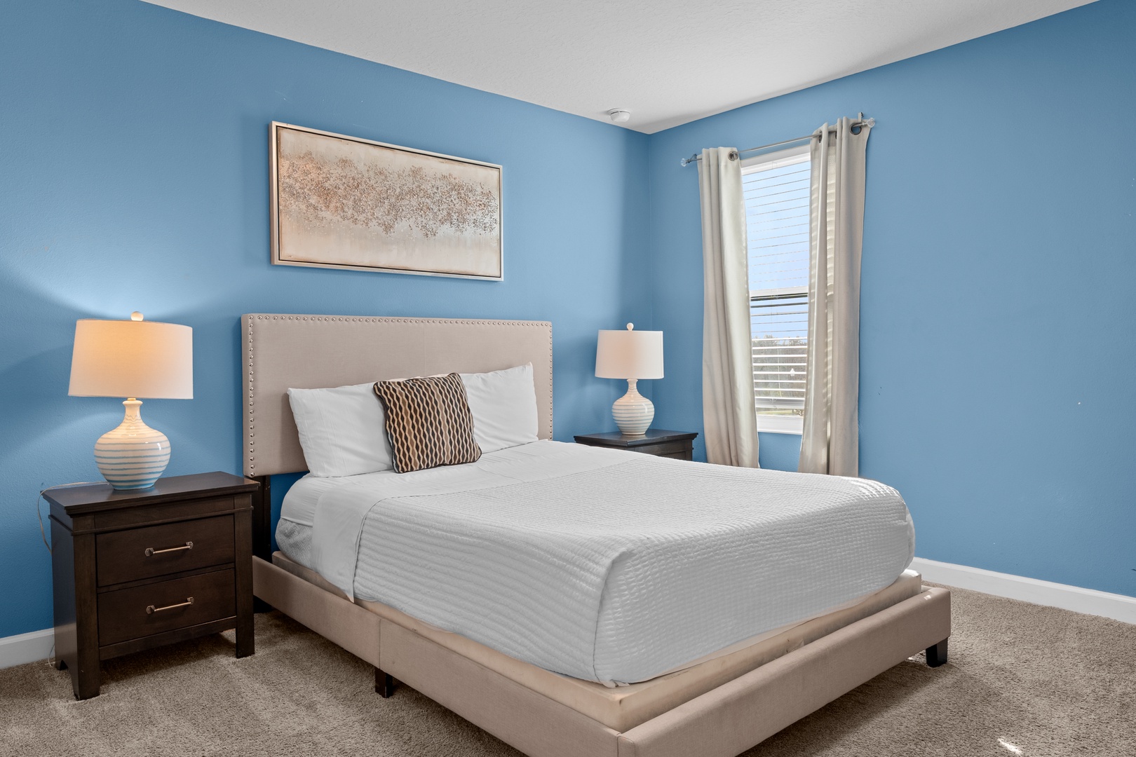 Rest peacefully in your serene blue bedroom with crisp linens and thoughtful touches designed for your comfort.