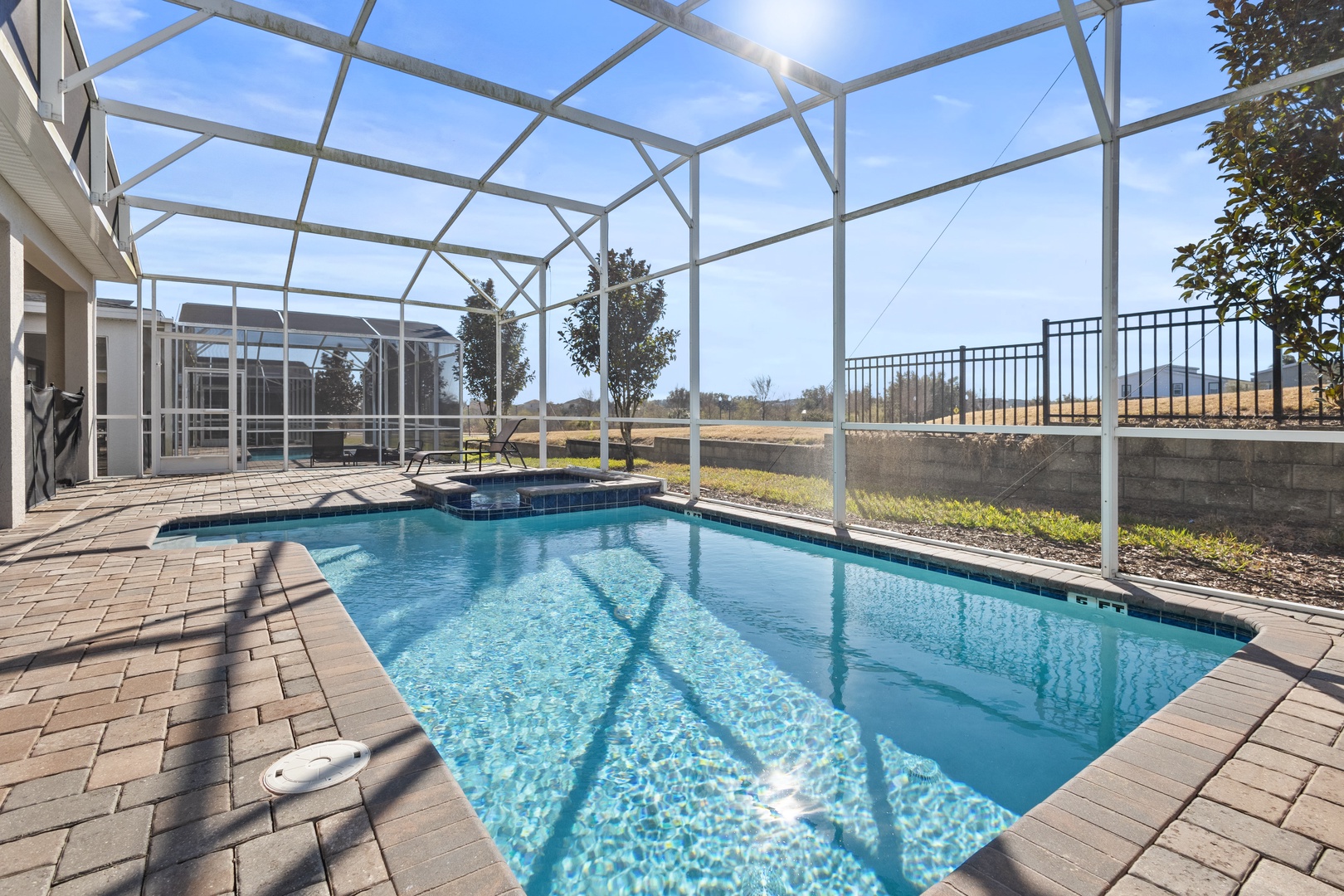 Your private pool oasis awaits with crystal-clear water and screened enclosure for comfortable swimming year-round.