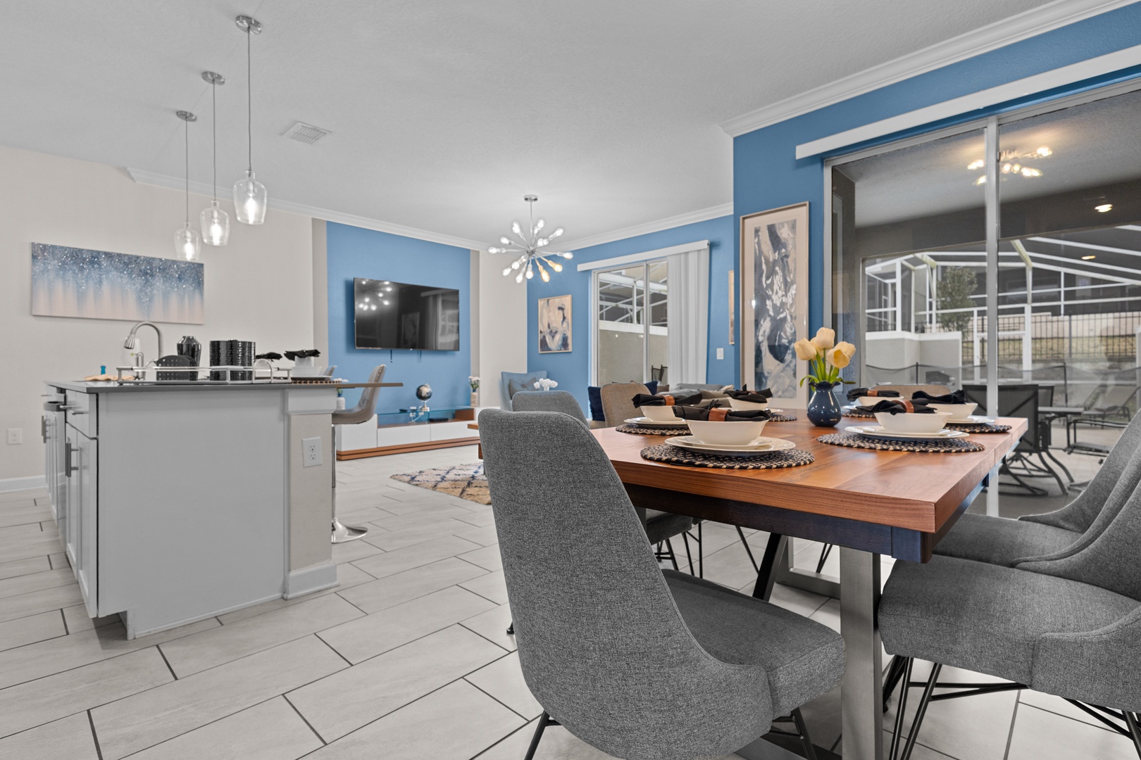 Gather around your stylish dining table where memorable meals await, seamlessly flowing into the bright modern kitchen perfect for creating culinary moments together.