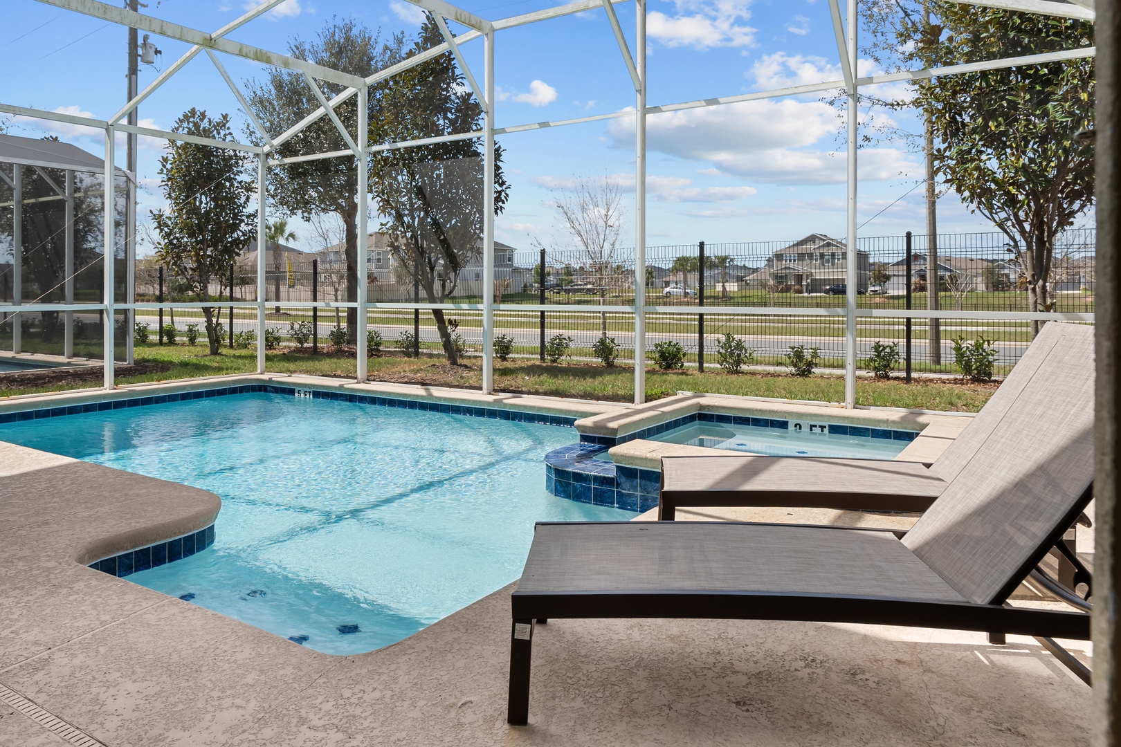 Unwind on your private poolside lounge chairs while soaking up Florida sunshine in your screened-in backyard oasis.