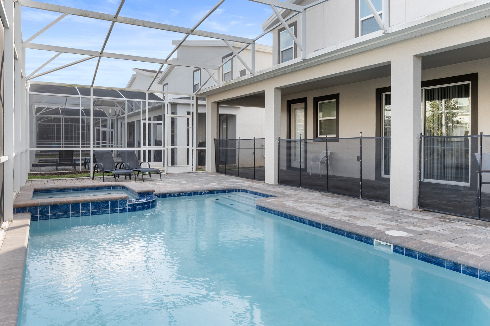 Your private pool oasis awaits with crystal-clear waters, covered lounging area, and safety features for peace of mind.