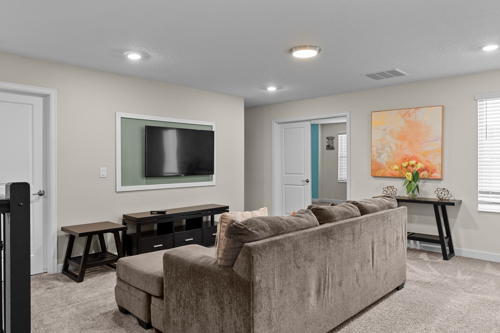 Unwind in your spacious living room with plush seating, flat-screen TV, and elegant touches that make every evening feel like a retreat.