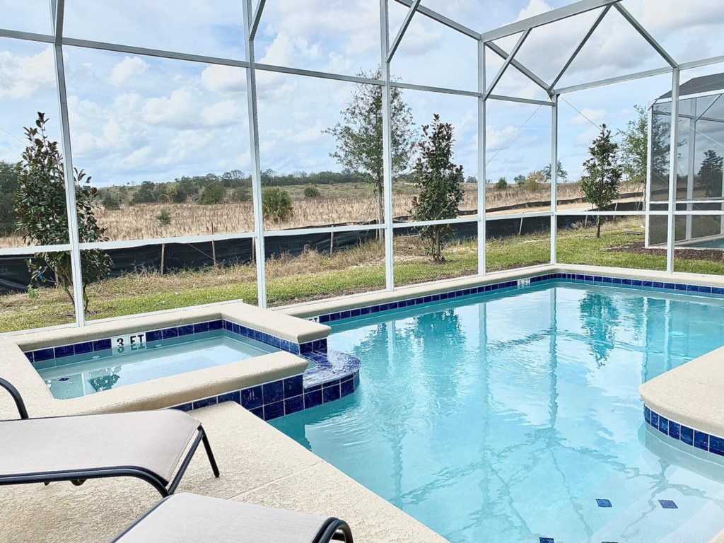 Private pool area, launge chairs and patio furniture