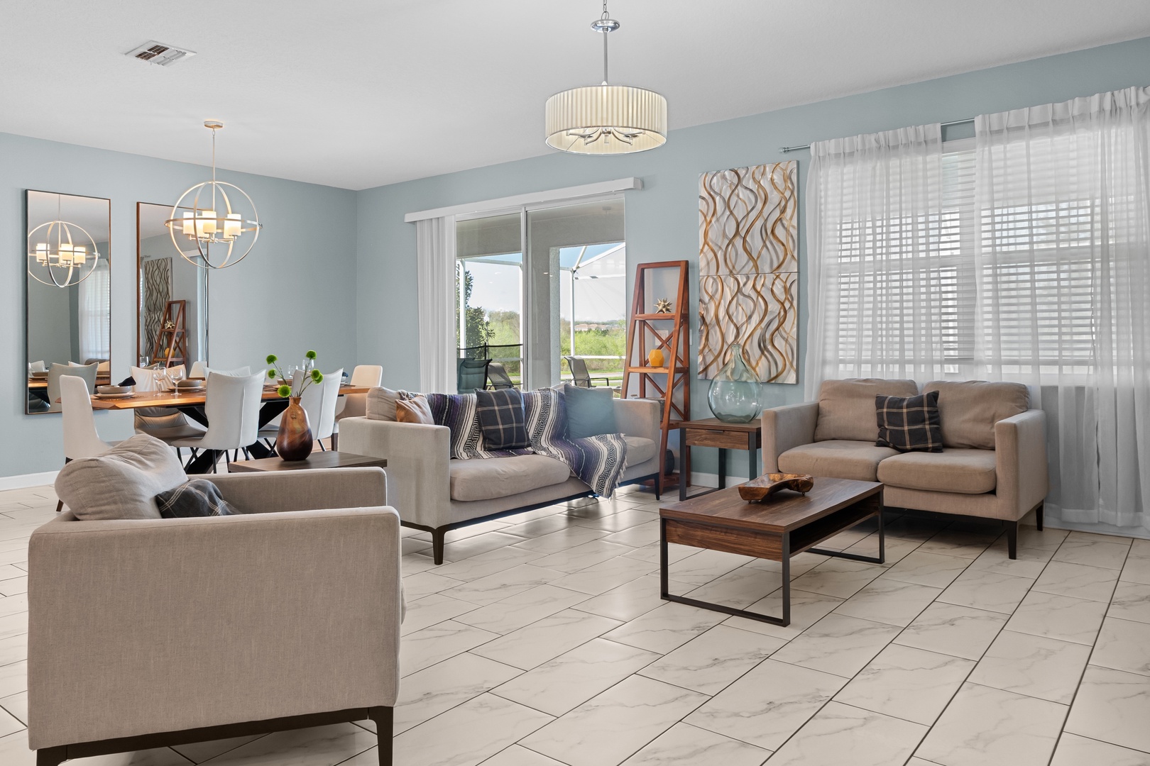 Unwind in your spacious living room featuring plush seating, modern décor, and abundant natural light streaming through elegant windows.