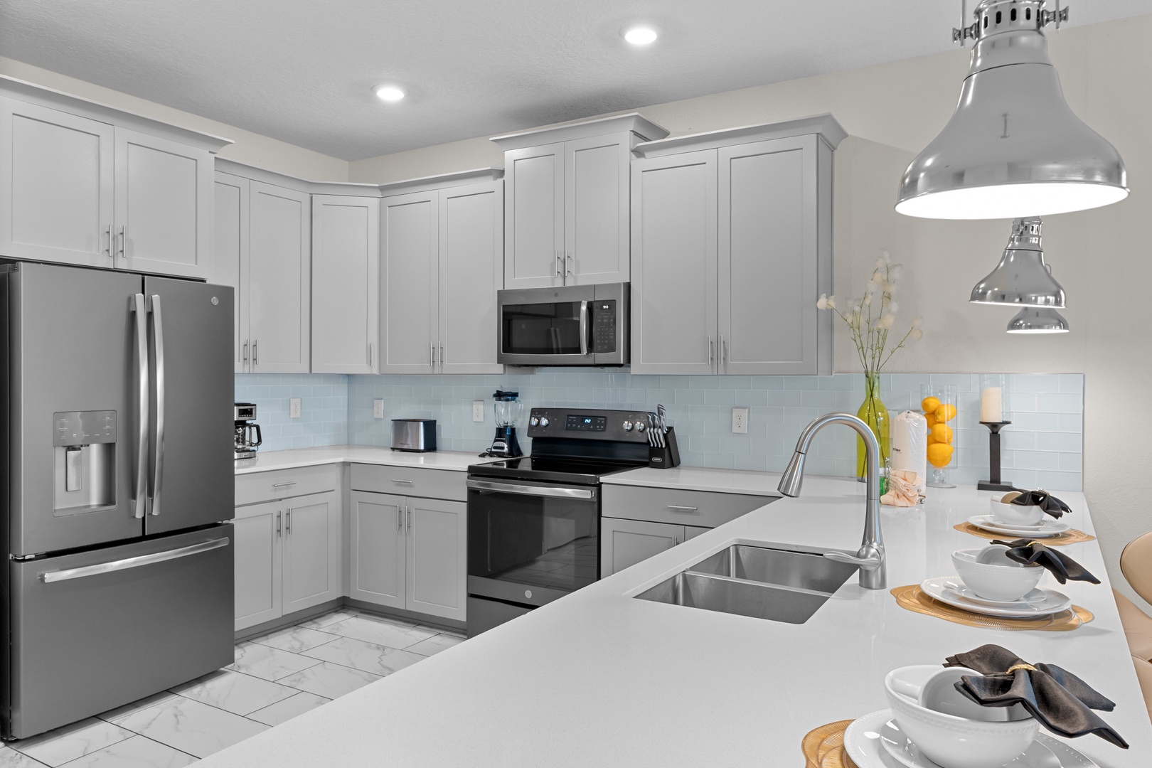 Your modern kitchen awaits with stainless steel appliances, quartz countertops, and all the tools you need to create memorable meals.