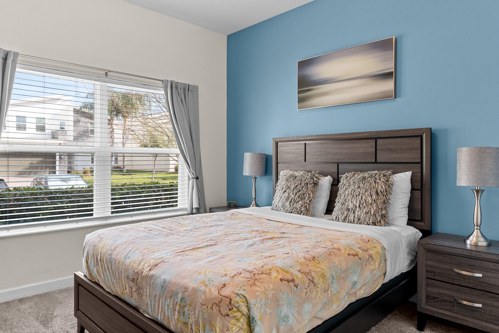 Sink into plush pillows and soft linens in your peaceful bedroom, where morning light streams through your window.