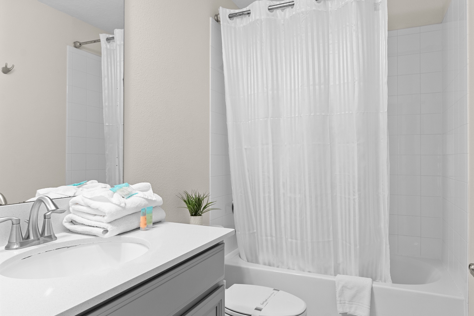 Step into your spa-like bathroom where fluffy towels await your arrival and a refreshing shower promises to wash away the day.