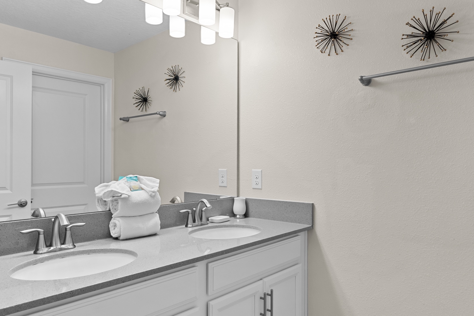 Freshen up in your bright dual-vanity bathroom with plush towels and modern fixtures creating a spa-like retreat.