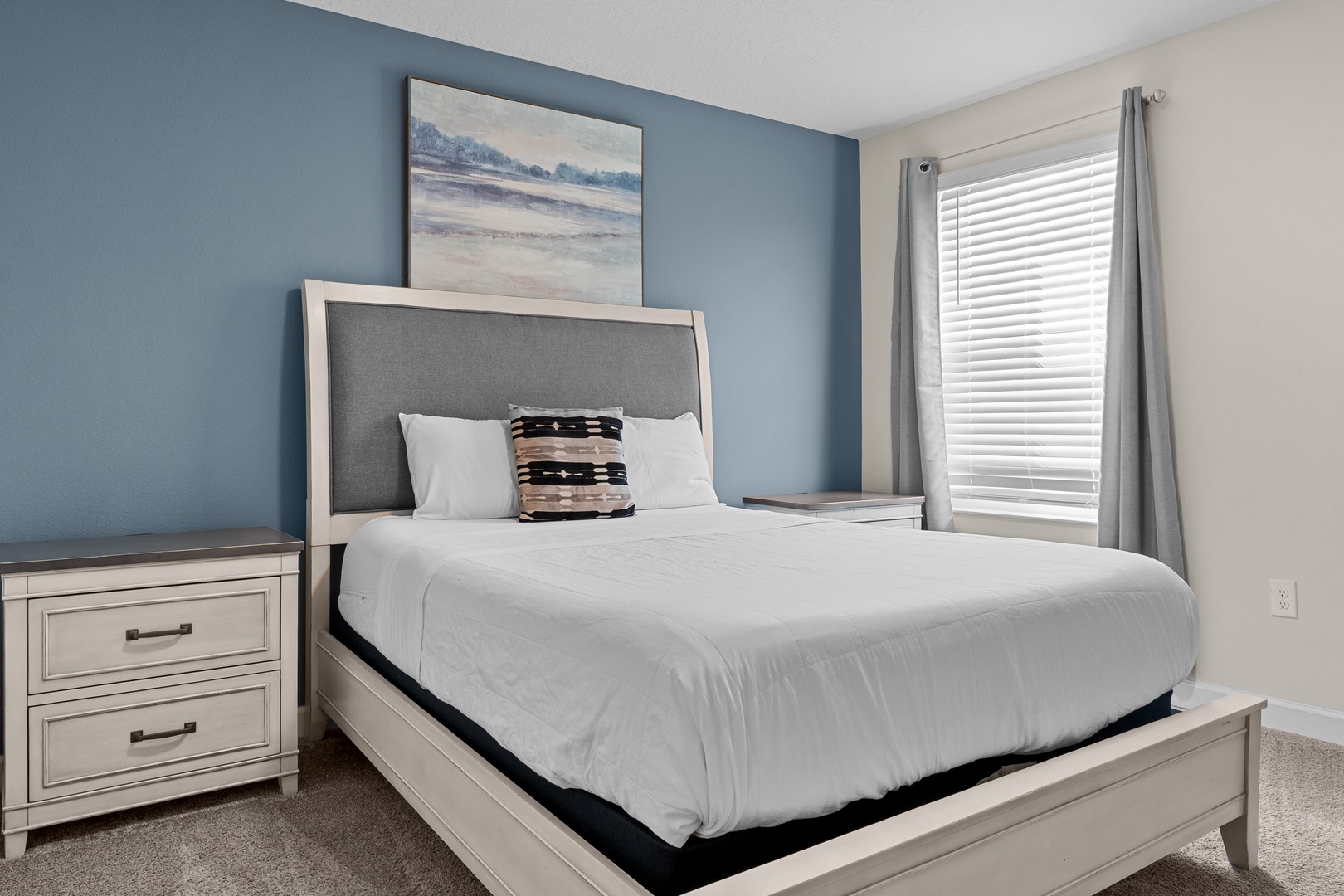 Drift off in your serene bedroom sanctuary, where soft coastal hues and plush bedding create the perfect retreat for peaceful nights.