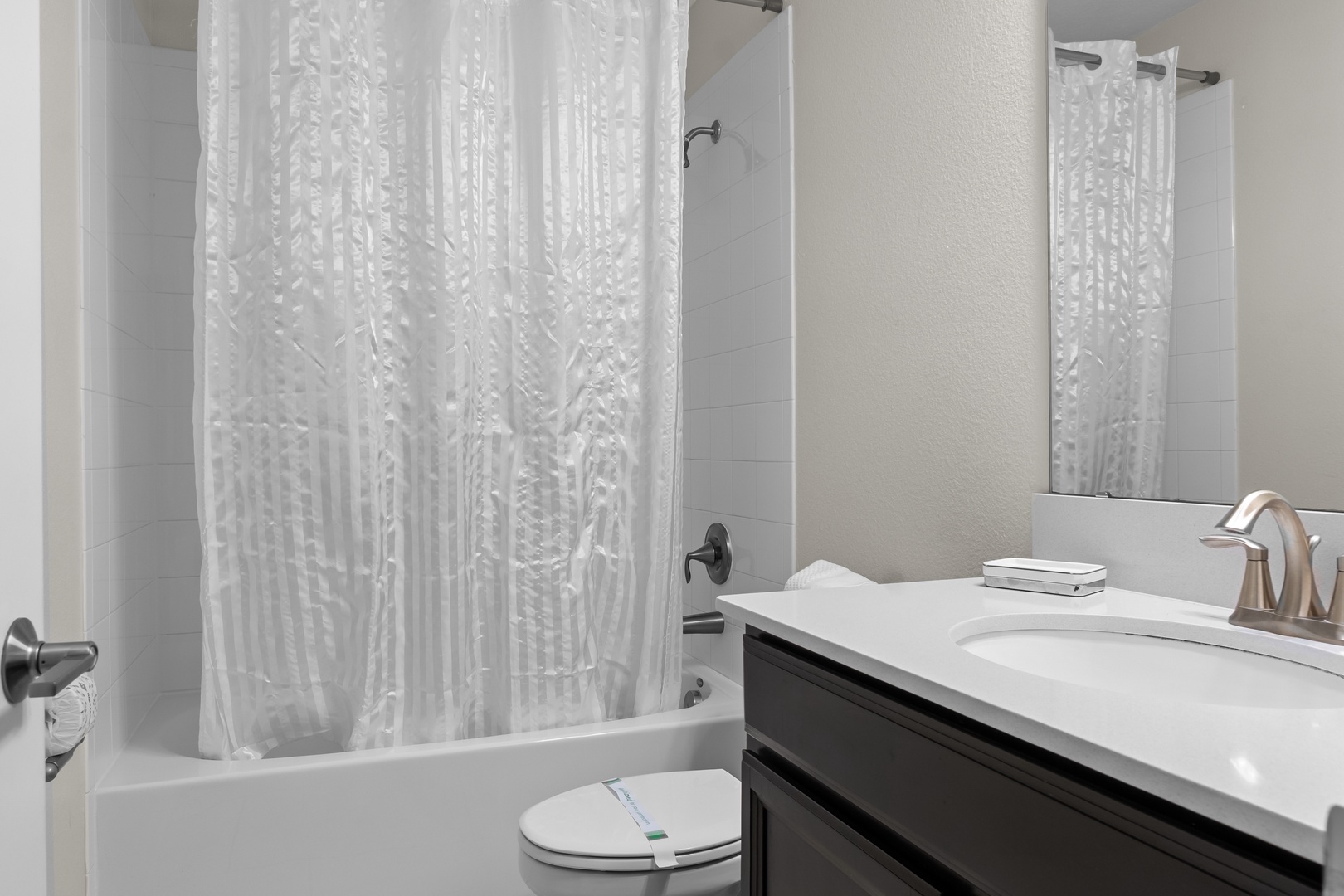 Refresh in your private bathroom with modern amenities and a relaxing tub-shower combo after your adventures.