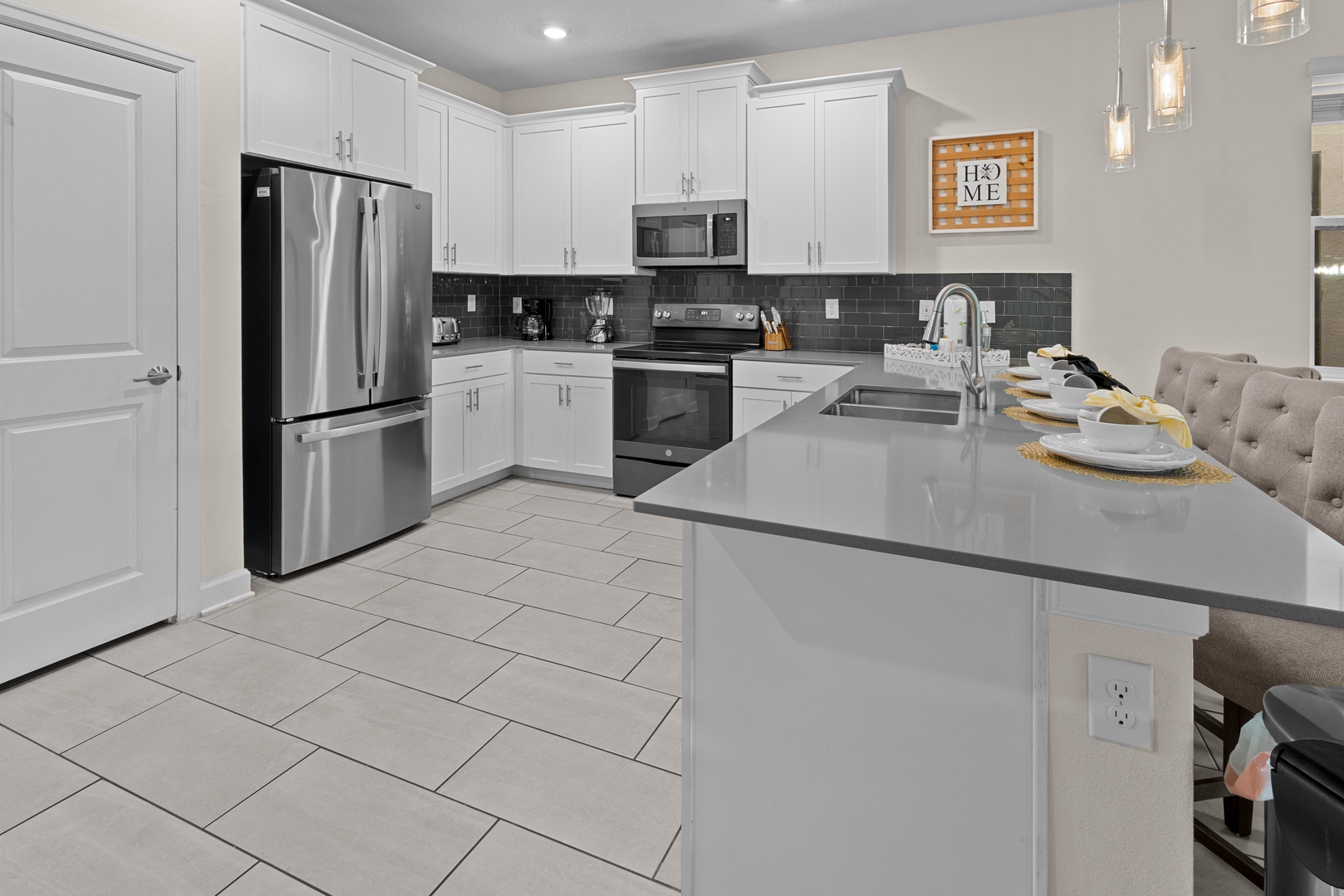 Your fully equipped kitchen features stainless steel appliances, quartz counters, and everything you need for memorable meals together.