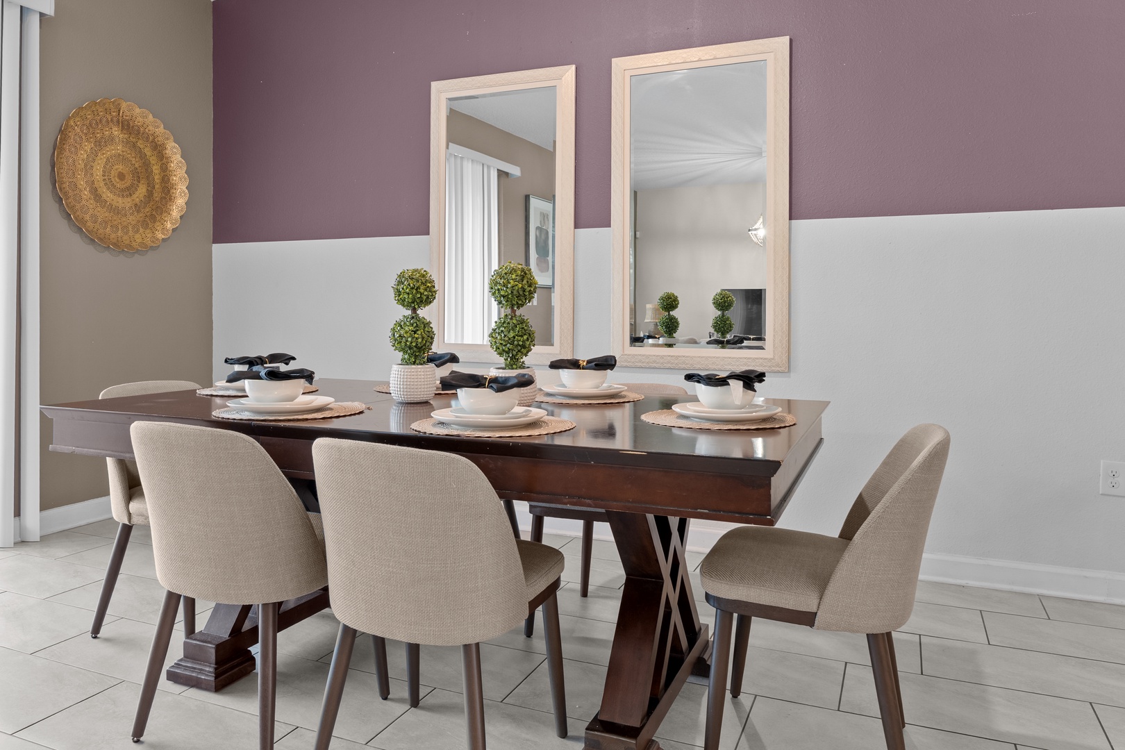 Share memorable meals at your elegant dining table, where warm lighting and stylish decor create the perfect atmosphere for conversation.