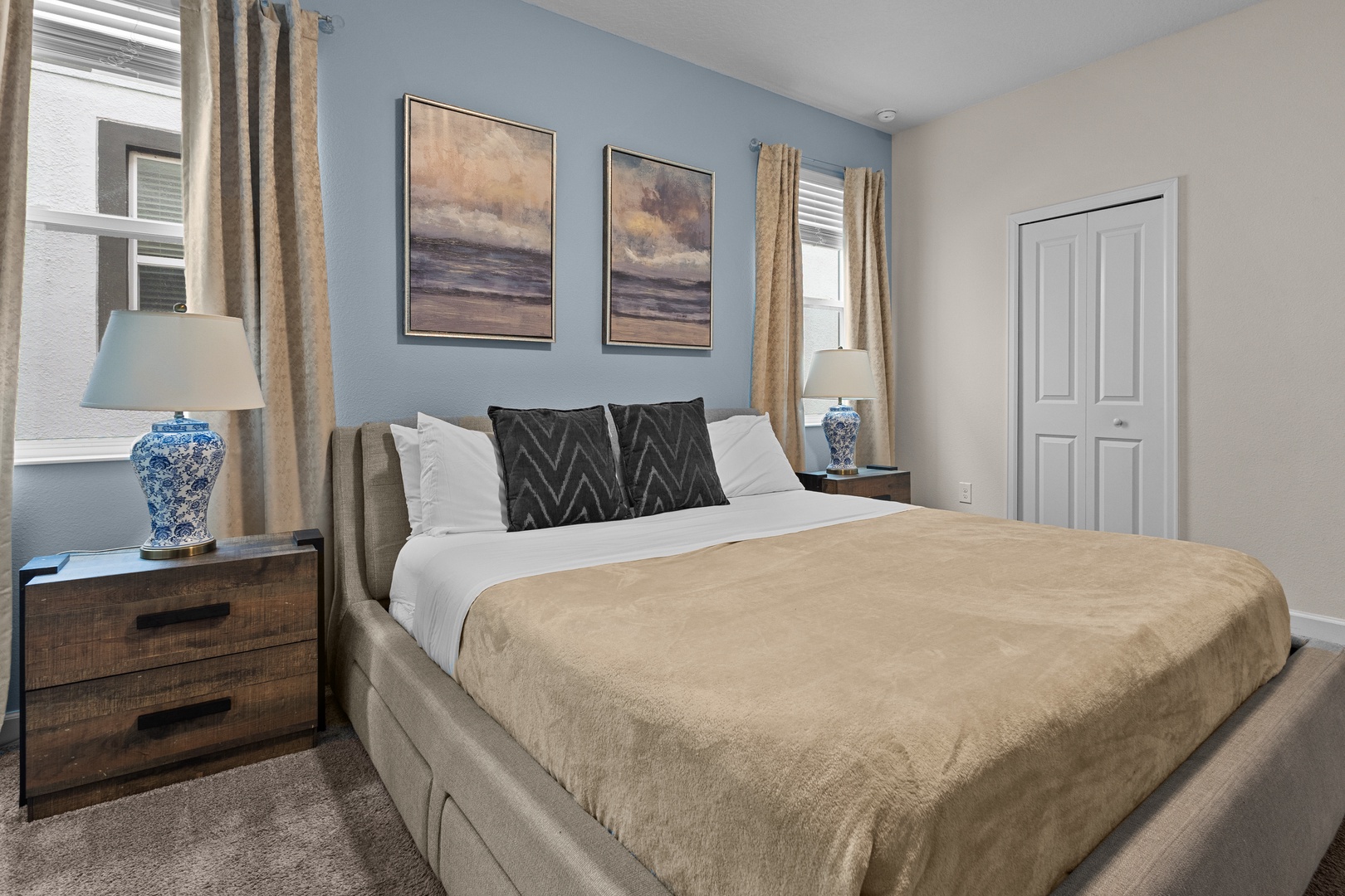 Drift off to peaceful dreams in your elegantly appointed bedroom, complete with plush linens and serene coastal artwork.