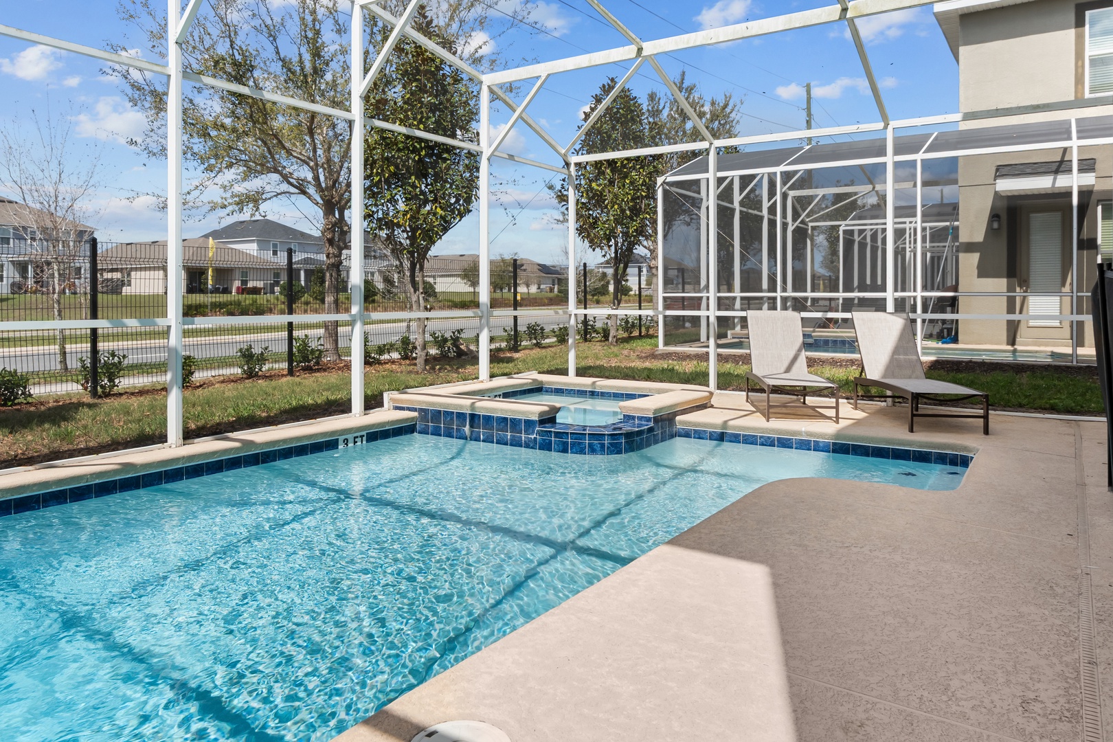 Your private screened pool and spa await - dive in or unwind in the bubbling hot tub while enjoying Florida sunshine.
