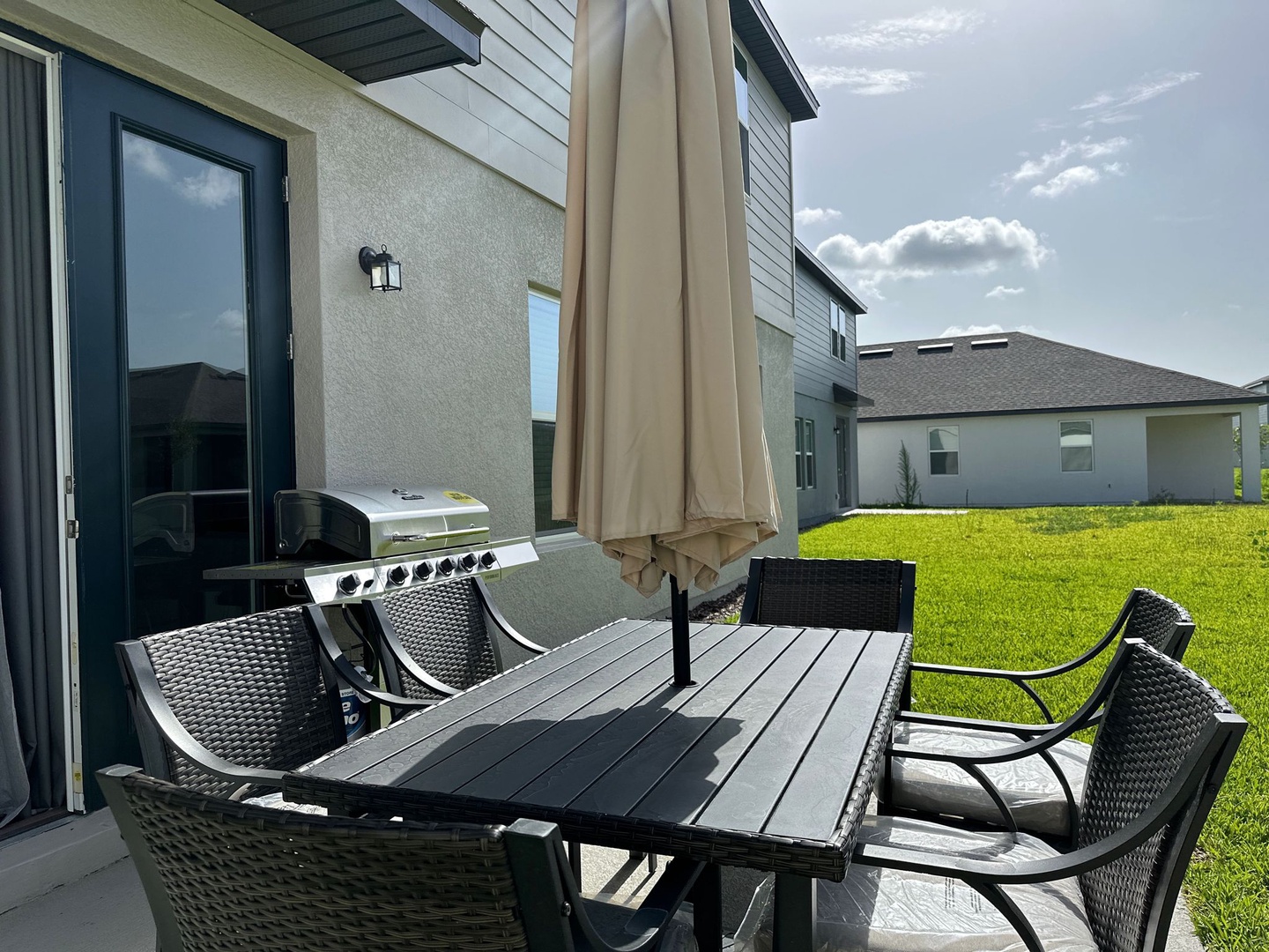 outdoor dining area with grill view