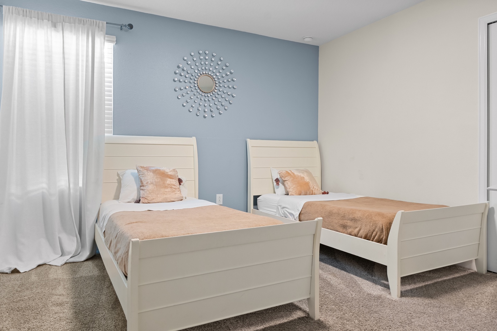 Your peaceful twin bedroom offers comfortable beds with soft linens, elegant décor, and natural light for restful nights.