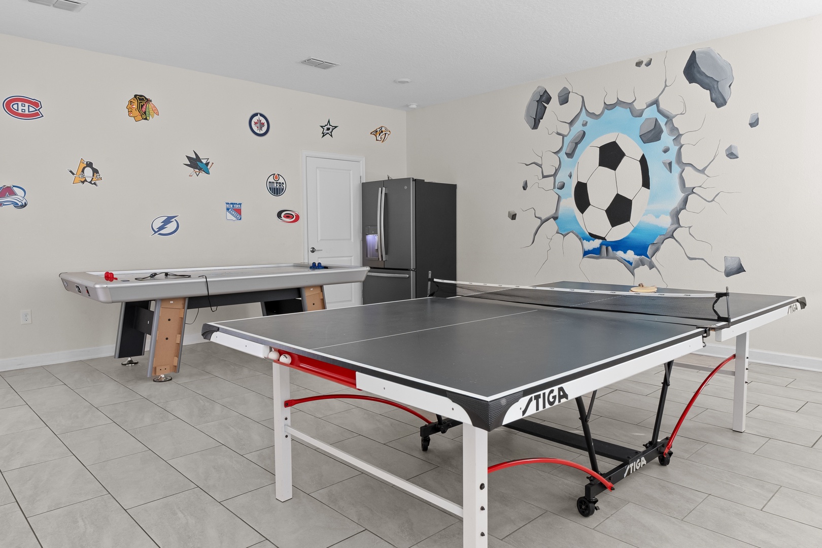 Challenge friends to ping pong or air hockey in your own private game room, complete with sports-themed decor.