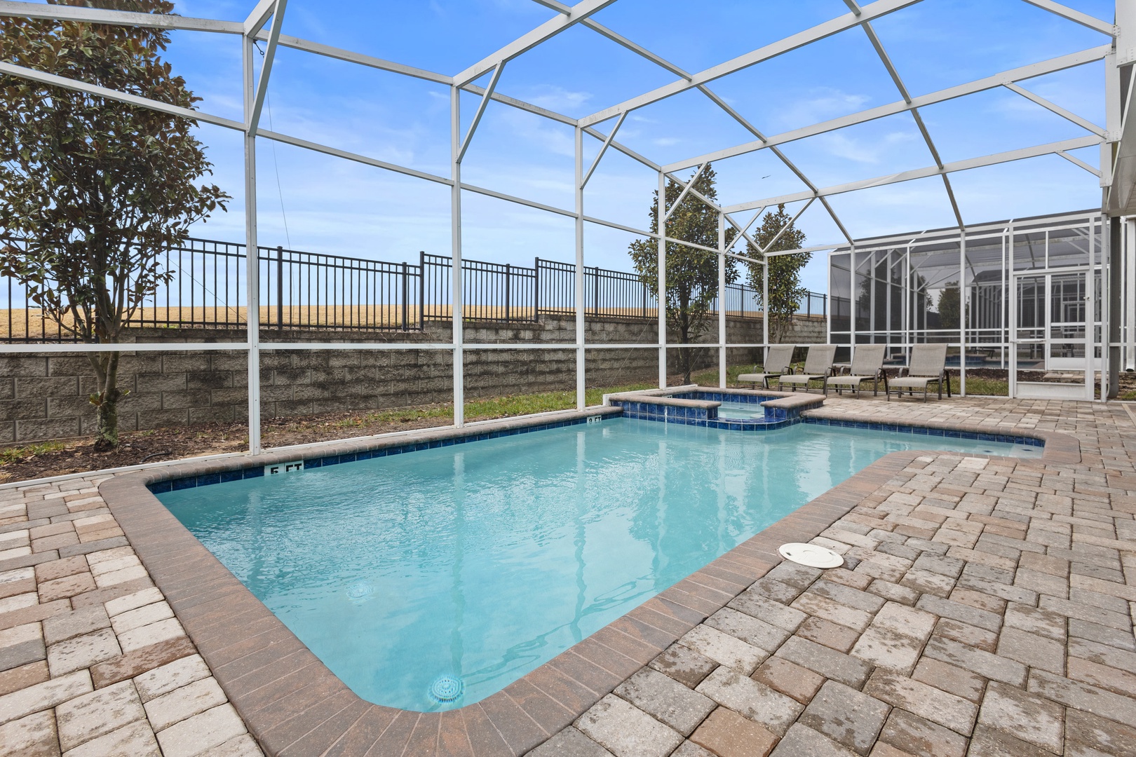 Step into your private oasis! Dive into the sparkling pool or unwind in the spa, all under a protective screen enclosure with peaceful views.