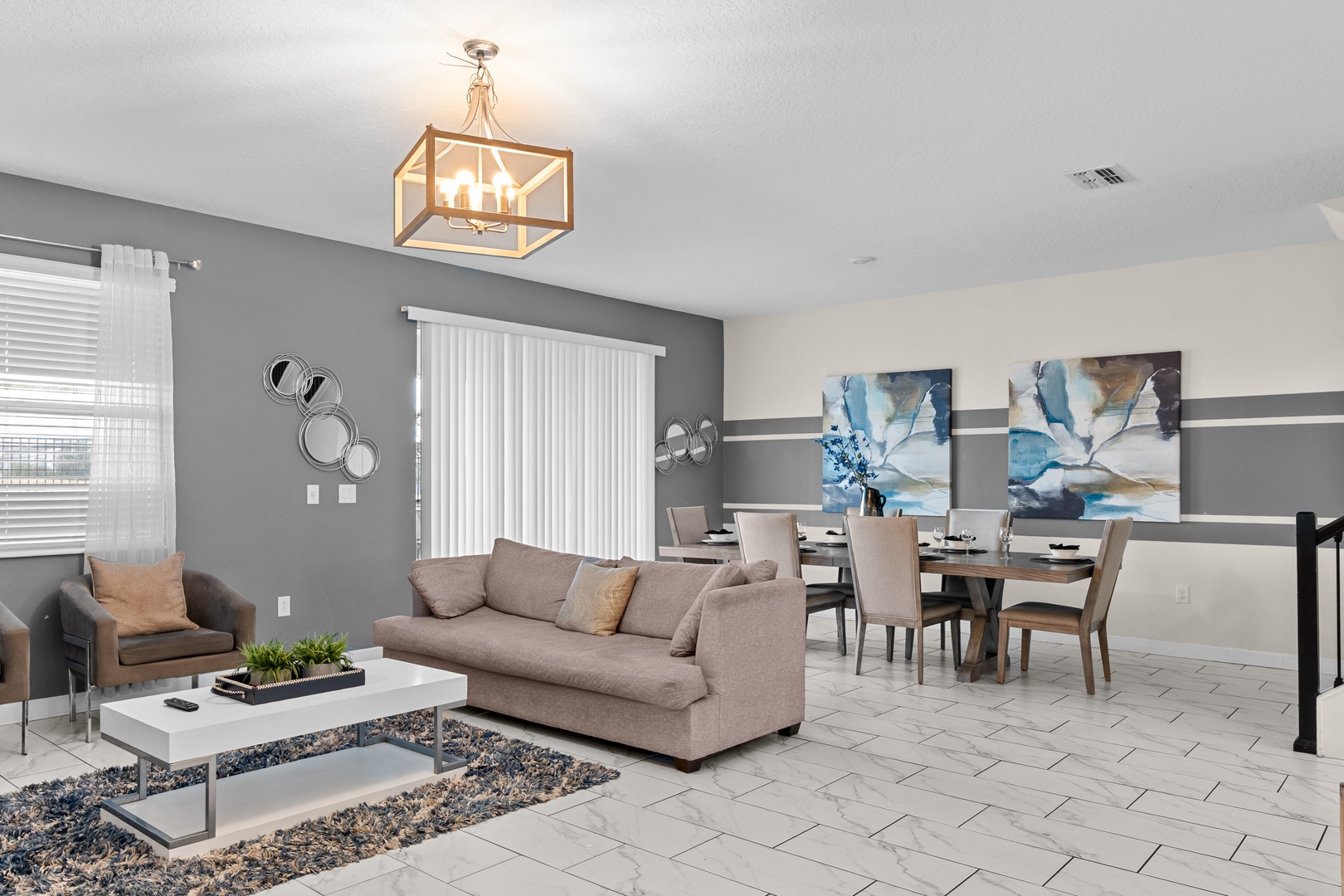 Settle into your stylish open-concept living space where modern comfort meets elegant design, perfect for relaxing or entertaining.