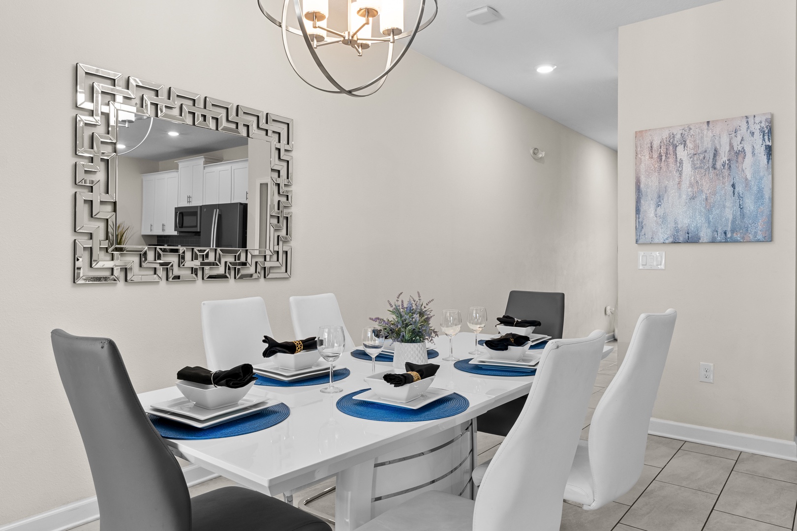 Gather around this elegant dining table where stylish decor meets comfort, creating perfect moments for your memorable vacation meals together.