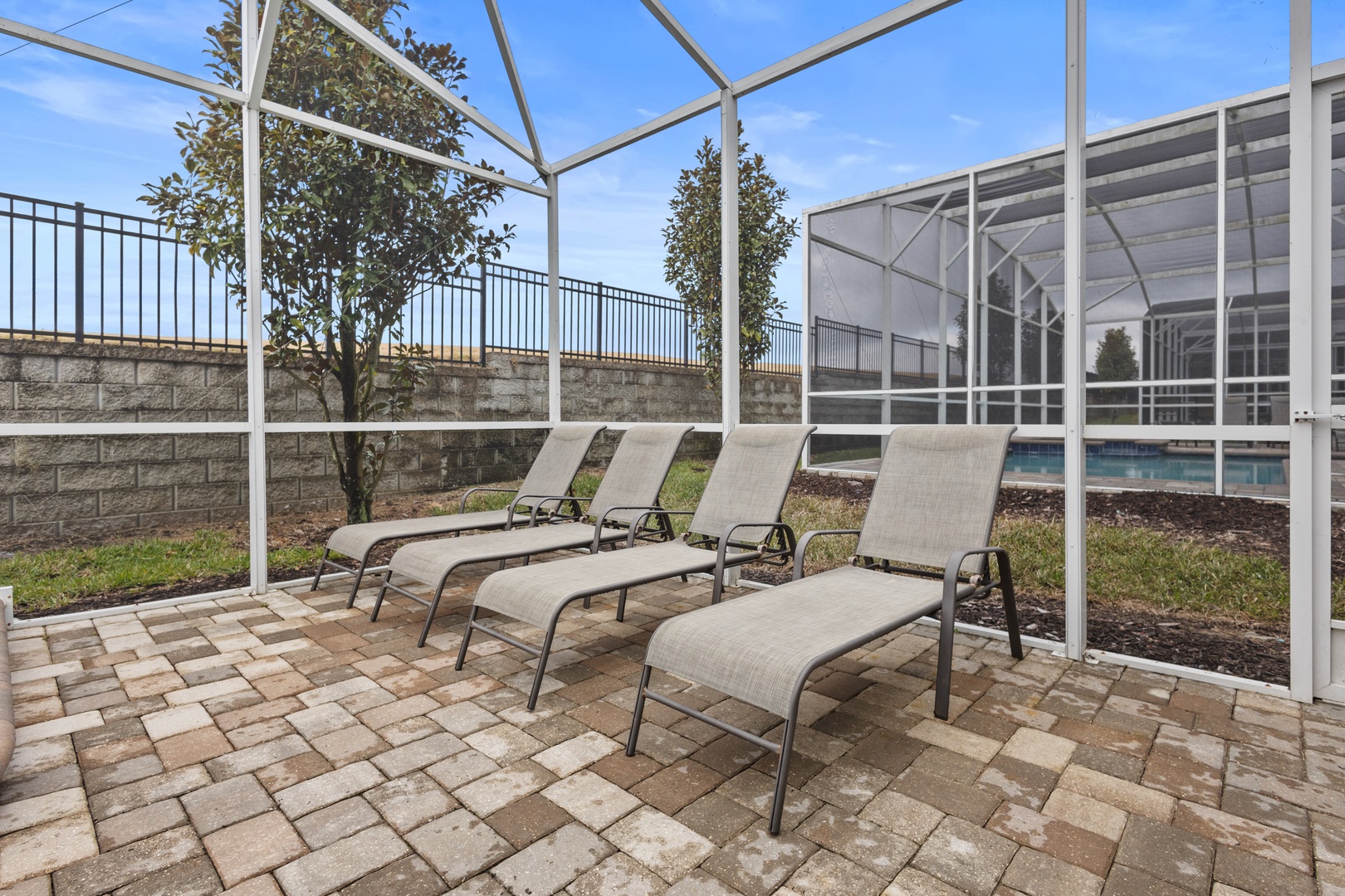 Relax on comfortable lounge chairs in your private screened patio, where you can soak up the sun while staying protected from bugs.