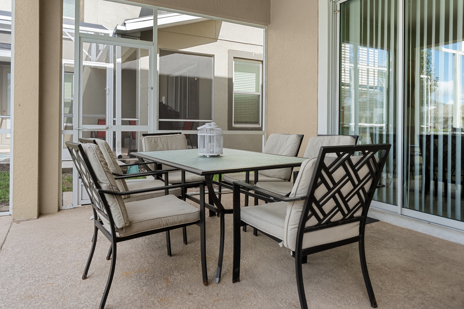 Enjoy outdoor dining on your private covered patio with comfortable seating for six and stylish glass-top table.