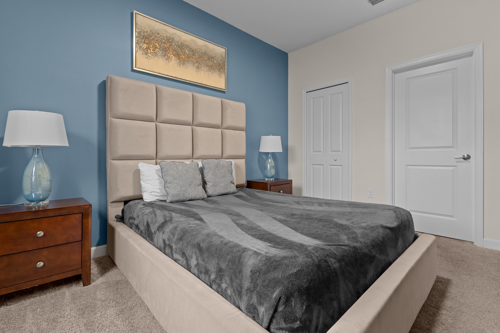 Sink into comfort with plush bedding and a stylish tufted headboard. Your peaceful retreat features soothing colors and elegant touches for perfect relaxation.