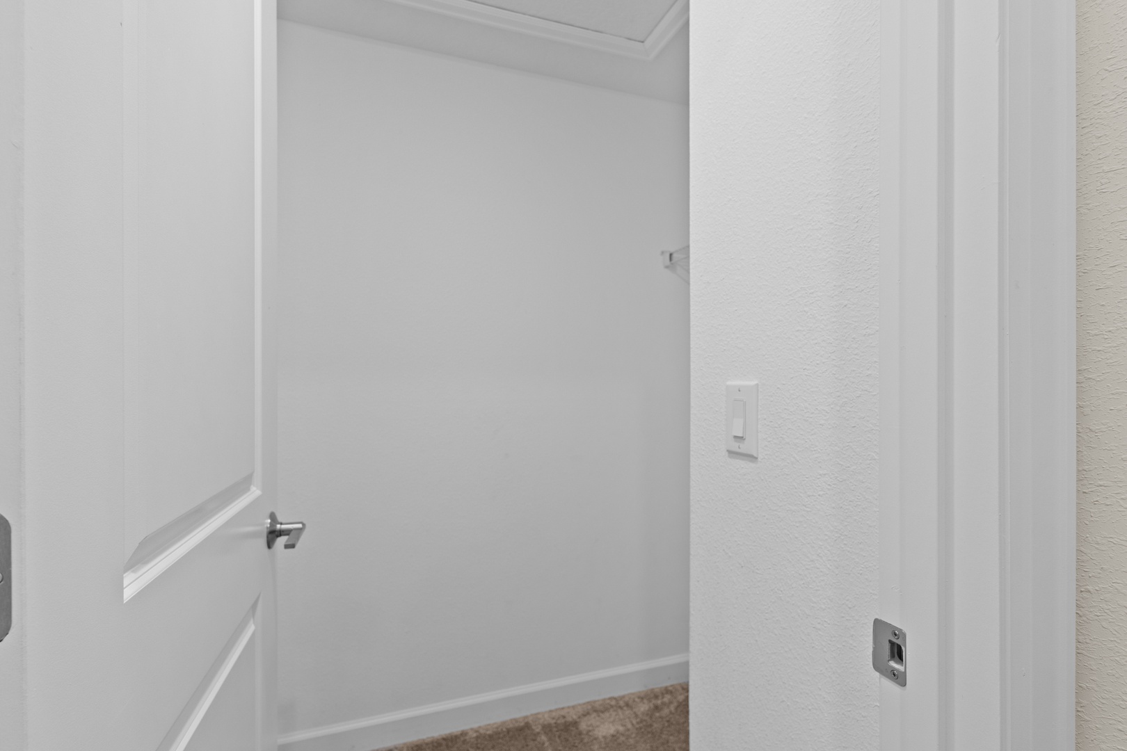 Your private laundry space features crisp white walls and convenient hookups for your washing needs during extended stays.