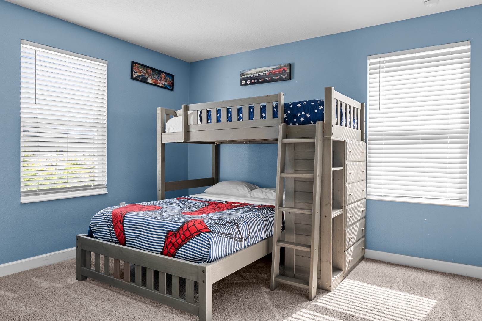 Your kids will love this cheerful bedroom with its sturdy bunk bed and superhero bedding, creating the perfect space for bedtime adventures.