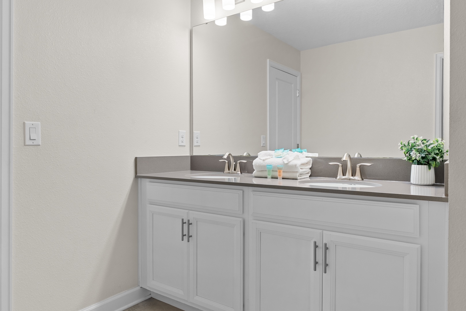 Freshen up at your spacious double vanity with premium amenities and soft towels ready for your comfort.