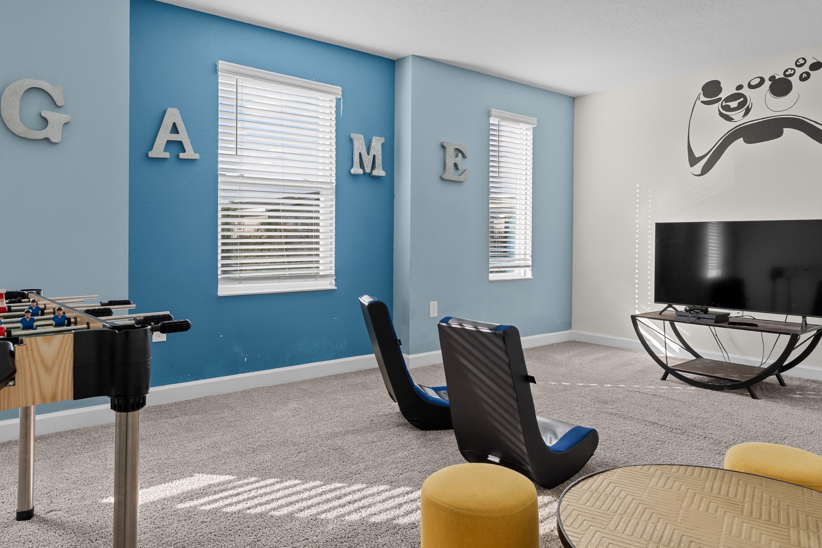 Challenge friends in your dedicated game room with foosball, gaming chairs, and entertainment center—perfect for friendly competition and memorable evenings together.