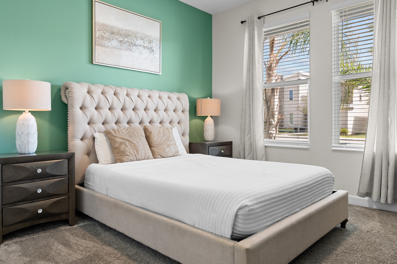 Sink into the luxurious tufted headboard and crisp linens while enjoying the bright natural light streaming through your windows.