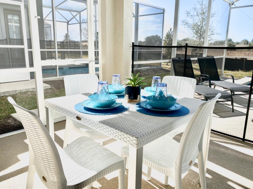 Patio dining table and pool area