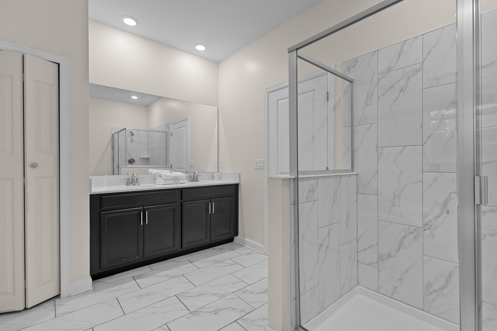 Step into your luxurious marble sanctuary, where pristine white surfaces and elegant fixtures create the perfect space to refresh and unwind.