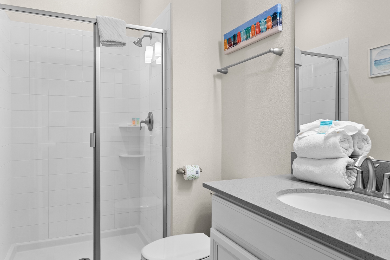 Step into your pristine bathroom with modern fixtures, fluffy towels, and a spacious walk-in shower perfect for refreshing after your adventures.
