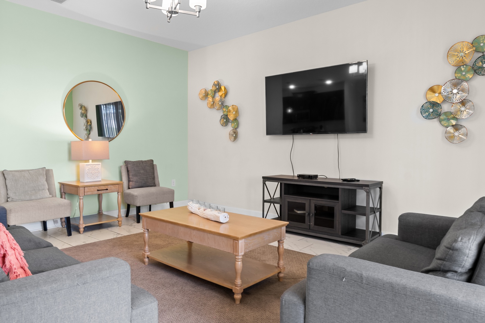 Unwind in your stylish living room with plush seating, modern decor, and entertainment center for cozy evenings.