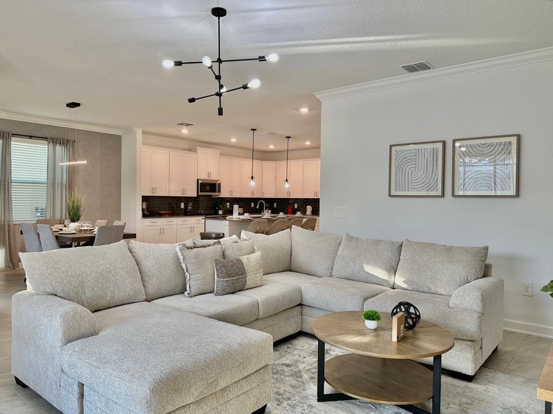 Sink into this plush sectional where you can unwind after your adventures. The open-concept design seamlessly flows to your fully equipped kitchen.