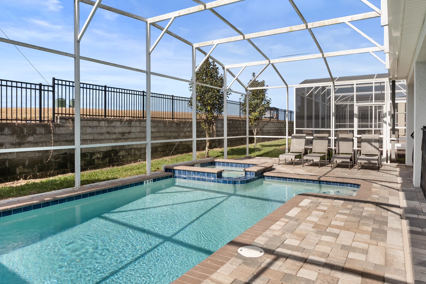 Your private screened pool and hot tub await, where you can splash in crystal-clear waters while staying perfectly comfortable year-round.