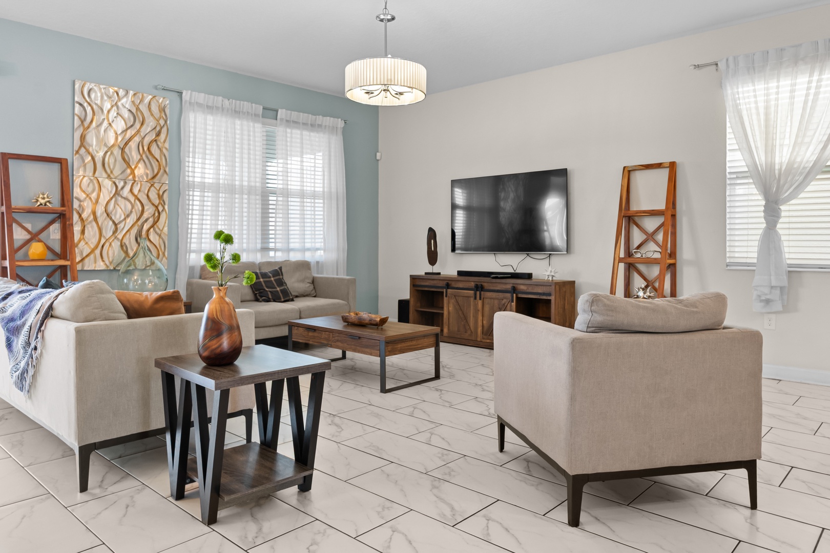 Relax in your spacious living room with plush seating, ambient lighting, and entertainment center - your perfect retreat after exploring.