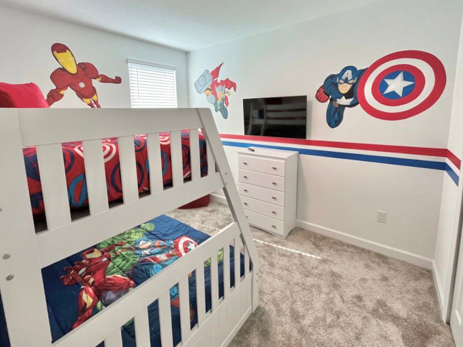 avengers themed room with bunk beds and trundle with TV