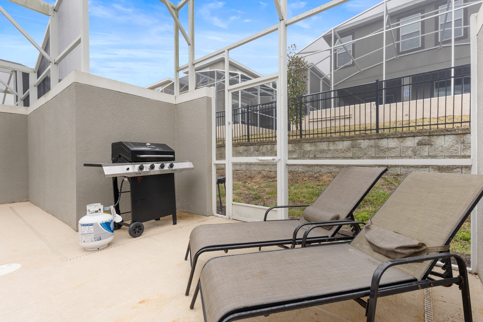 Unwind on your private screened patio with comfortable loungers and your own BBQ grill for perfect outdoor dining.