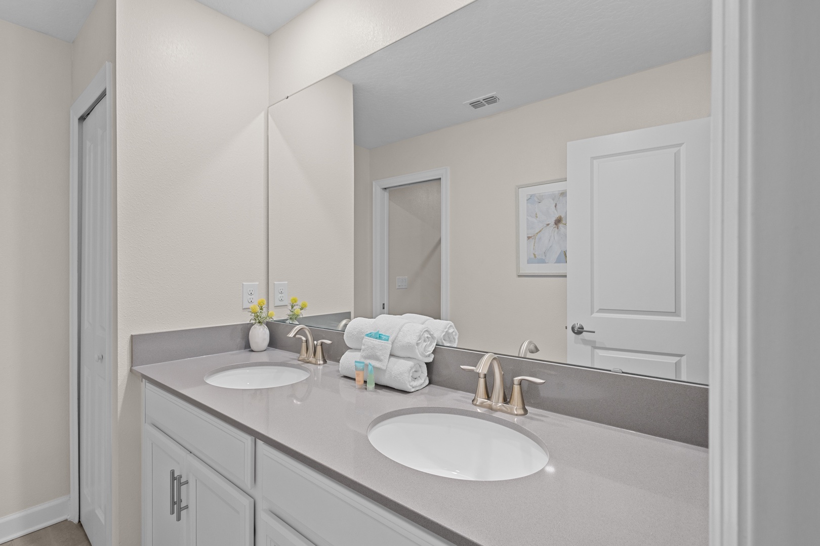 Refresh in your elegant dual-sink vanity with plush towels and thoughtful amenities awaiting your arrival.