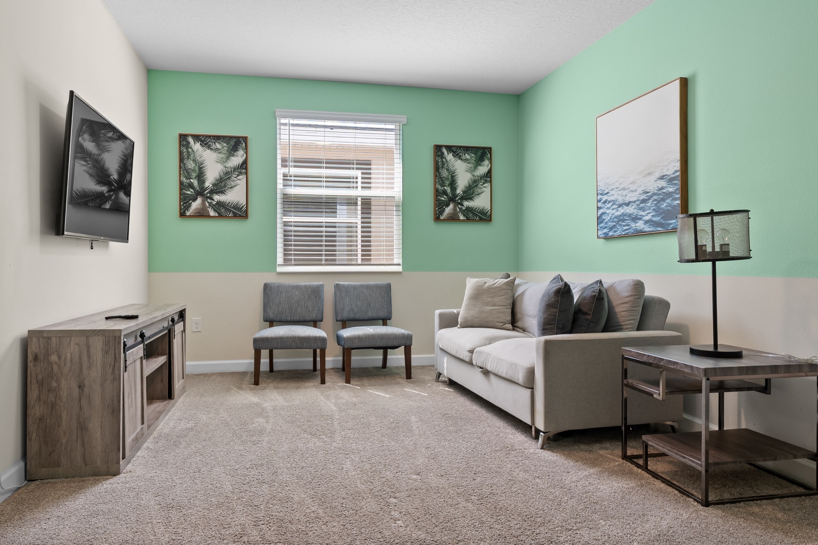 Unwind in your bright living space with plush seating, modern décor, and soothing mint green walls that create the perfect backdrop for relaxation.