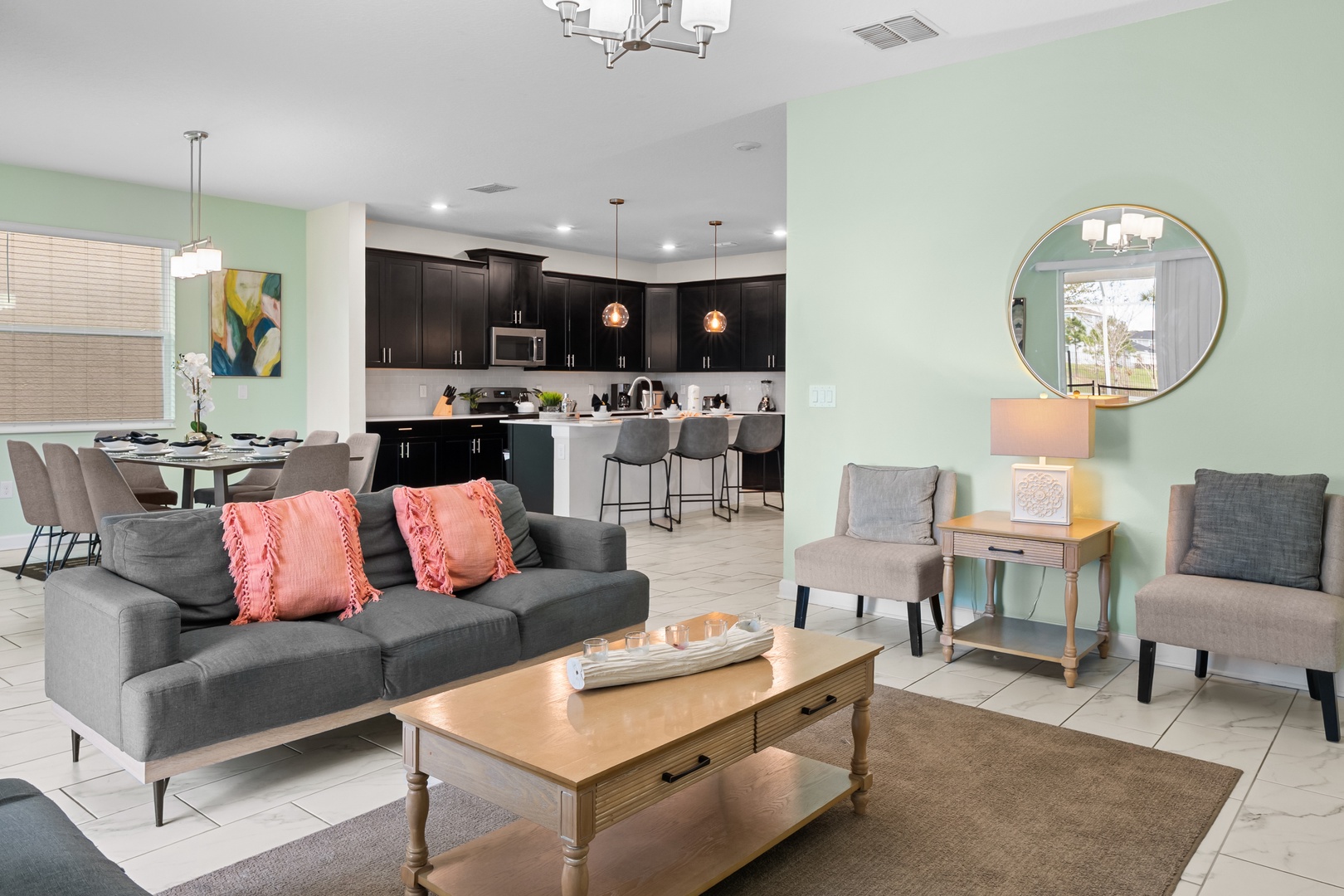 Unwind in your spacious open-plan living room with modern comforts and stylish décor that flows seamlessly into your fully equipped kitchen.